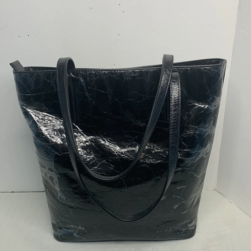 Michael Kors a black Vertical Tote.